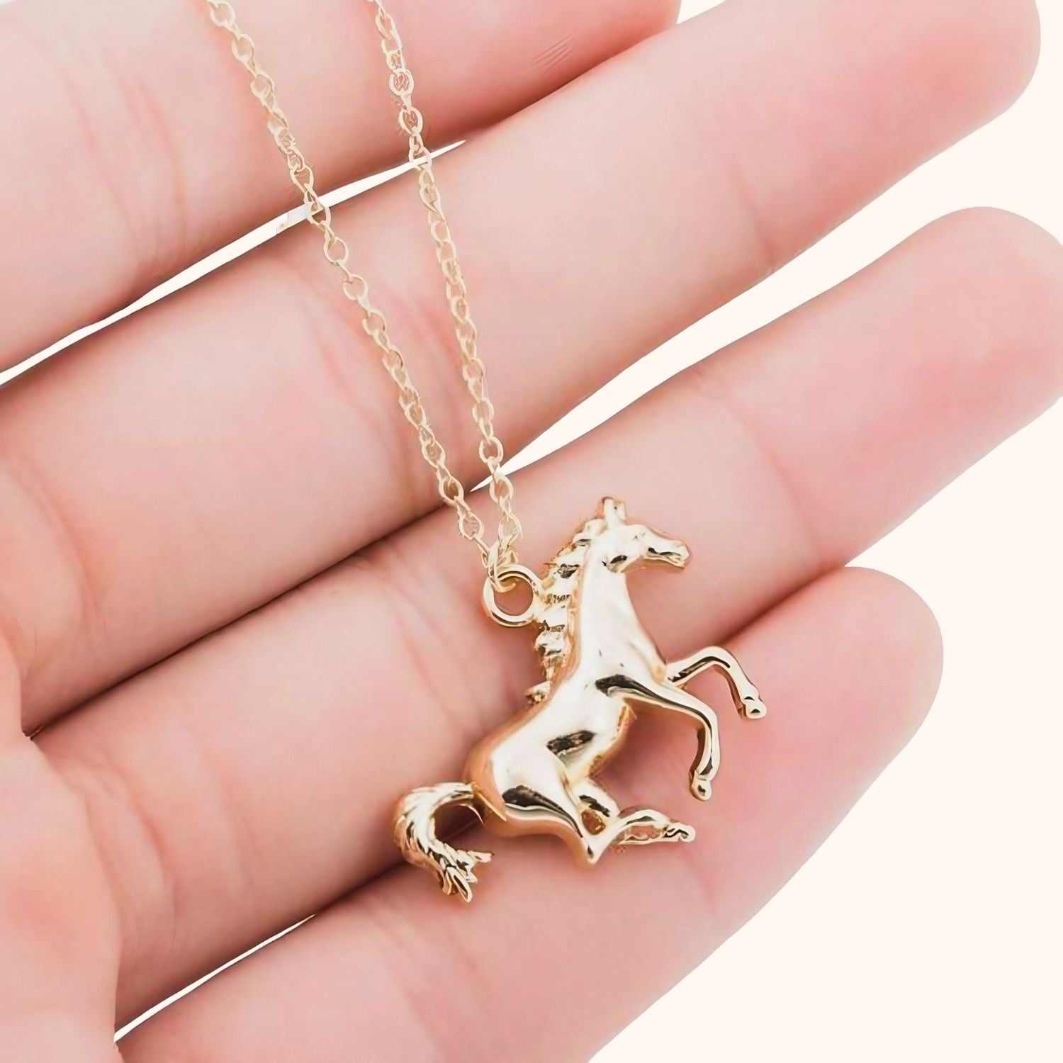 Collier doré petit cheval