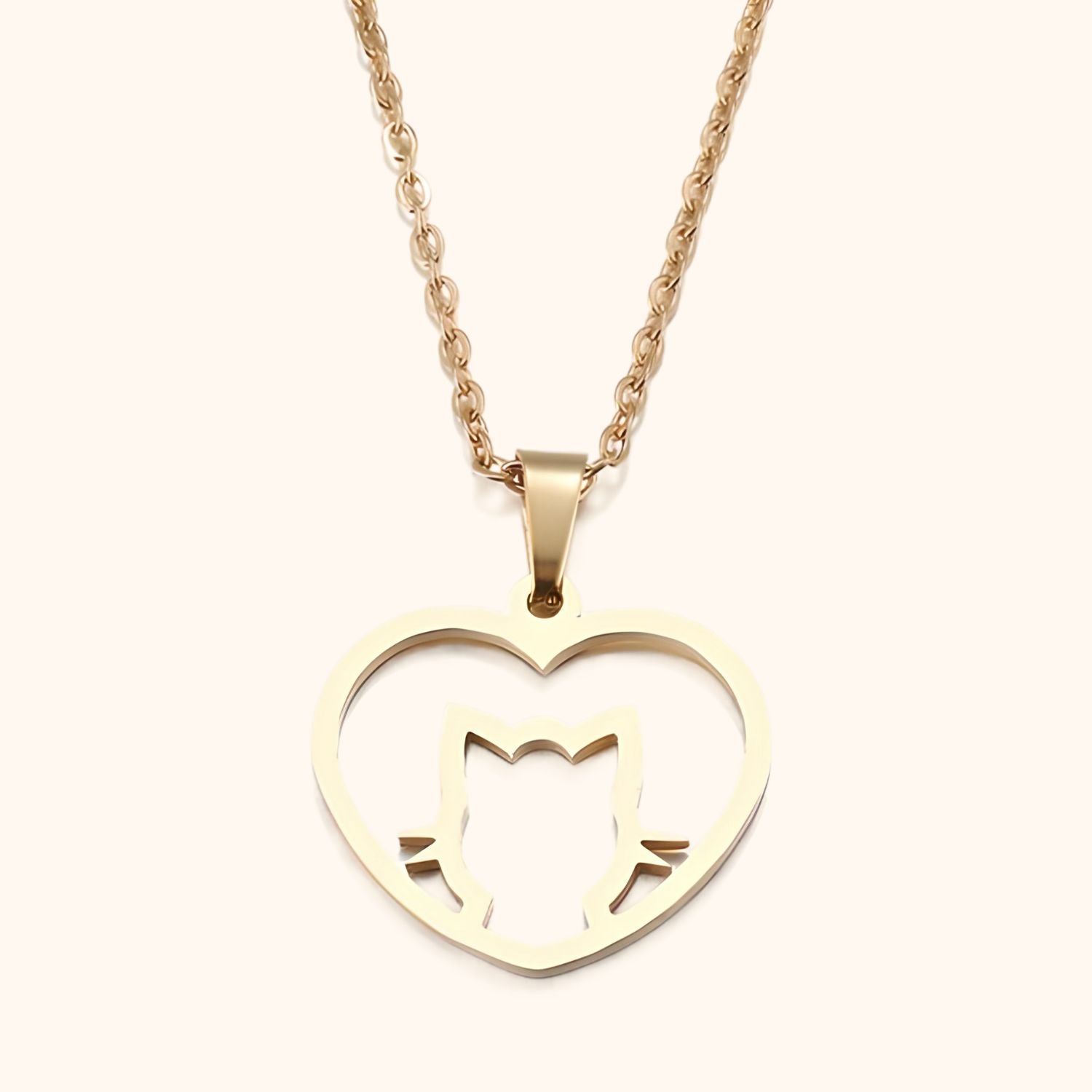 Collier doré chat accompagné d'un cœur