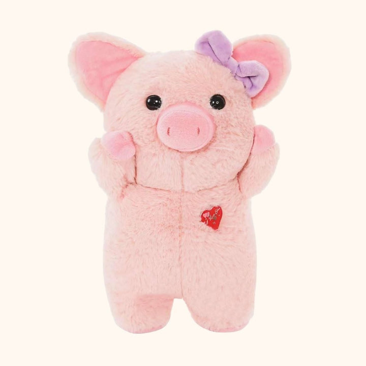 Dans mon humble ferme, une ribambelle de cochons en peluche roses, ornés de petits nœuds, égaient les journées de tous avec leur douce tendresse